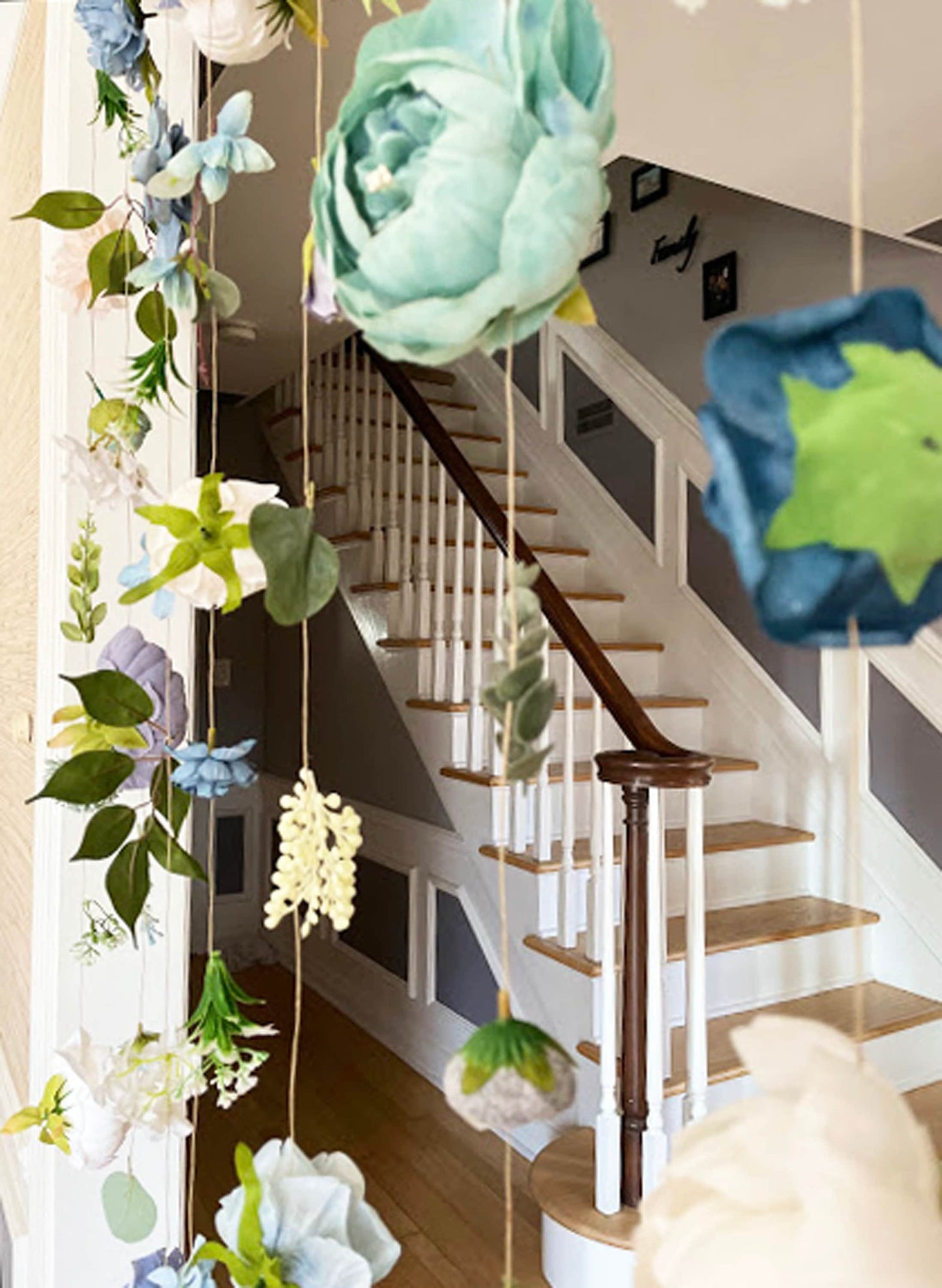 Decorative floral garlands hanging from a staircase