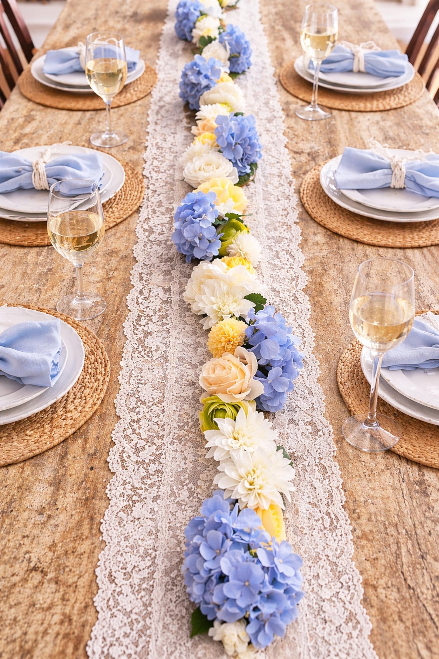 Elegant table setting with a floral runner and wine glasses.