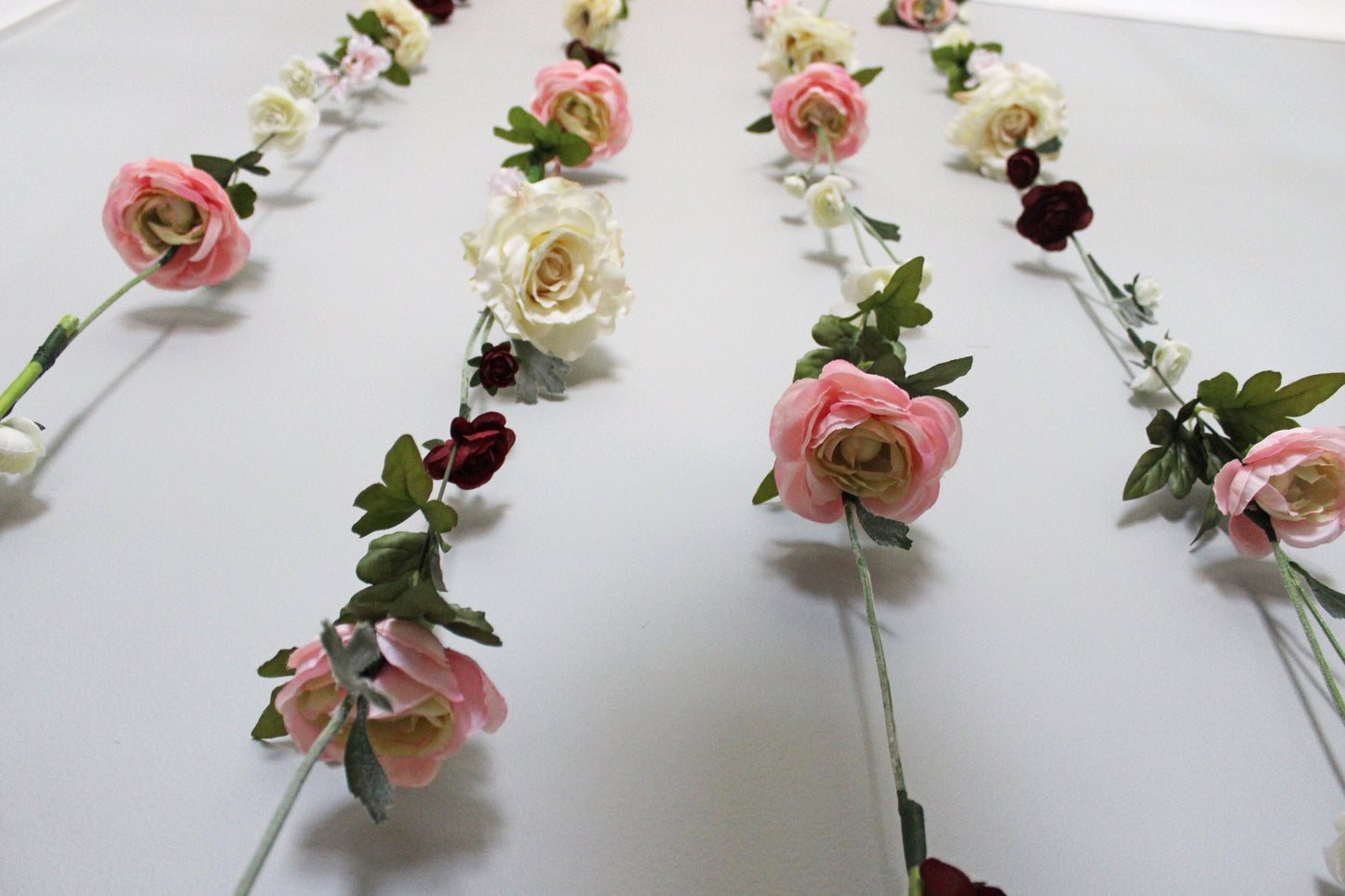 Decorative floral arrangement on a white surface